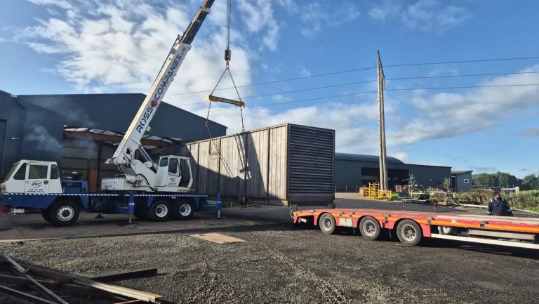 Ross Companies crane loading a bespoke container