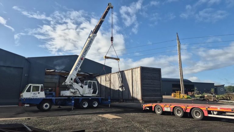Ross Companies crane lifting a bespoke container