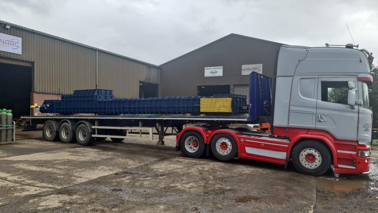 Drag chain conveyor loaded for delivery