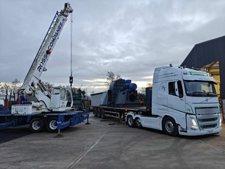 Crane loading plant onto an artic