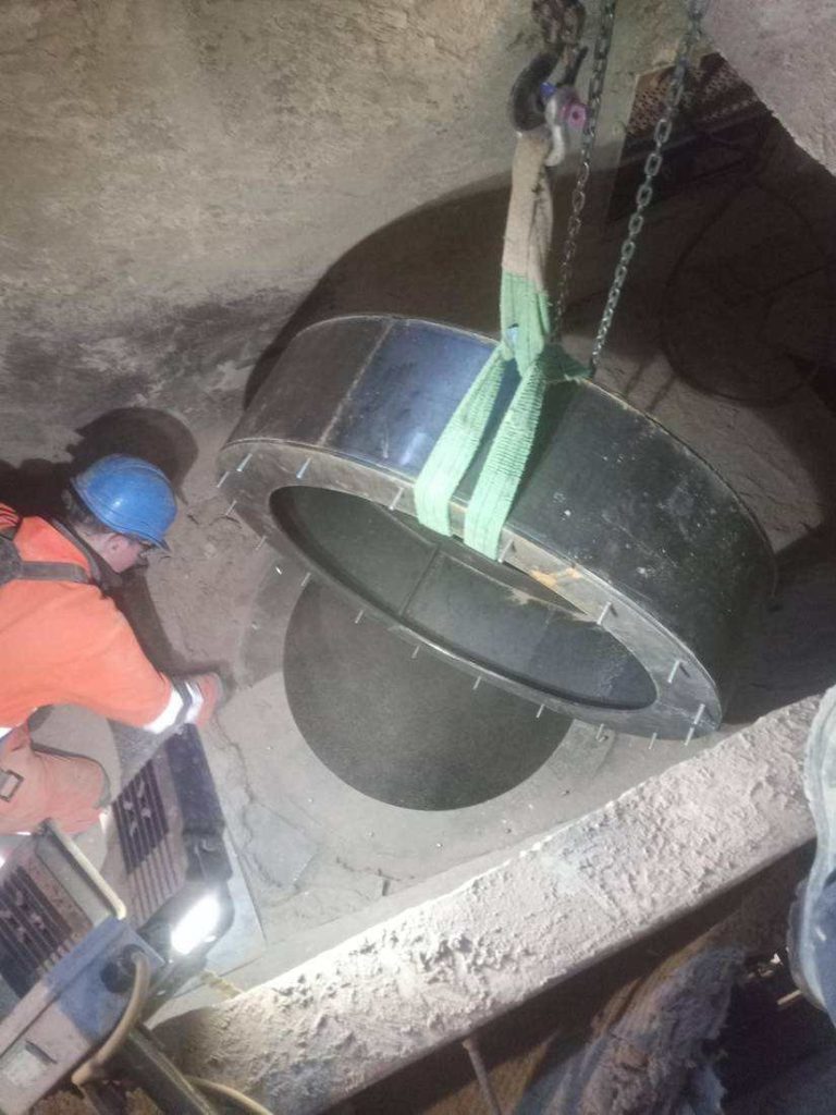 Engineer machining a large steel ring