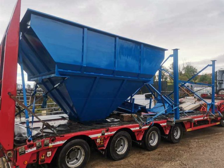 Blue hopper on a low-loader