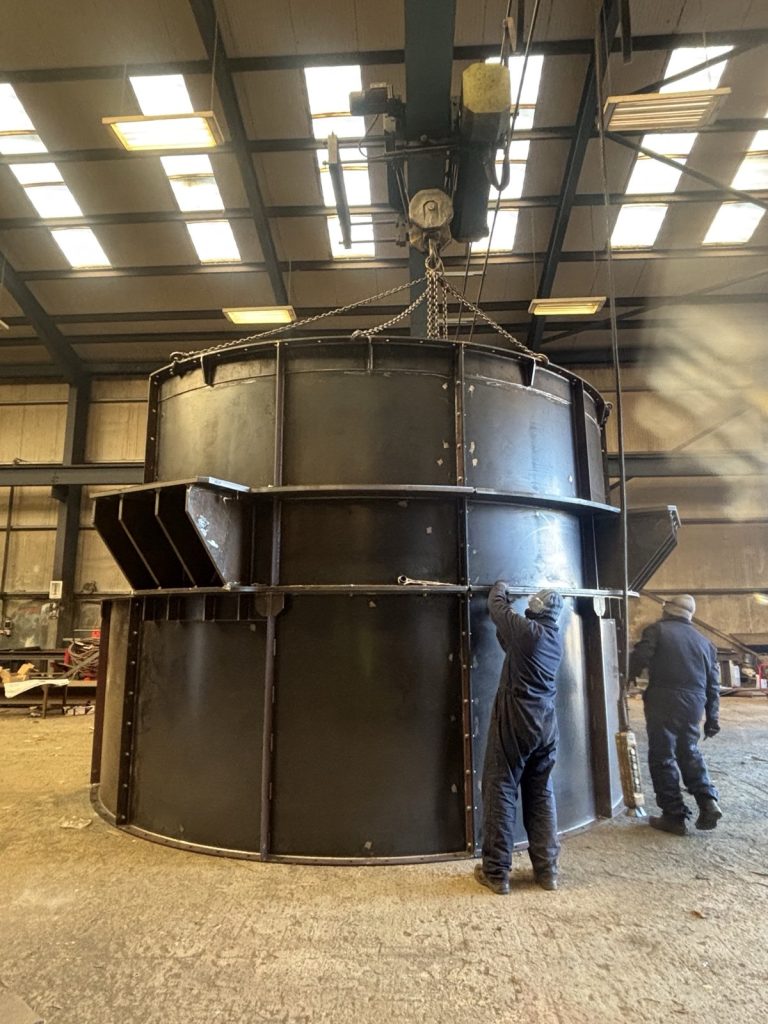 Large cylindrical housing on the workshop crane