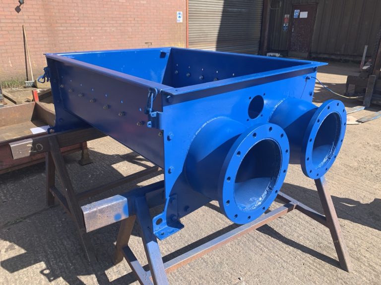Twin-outlet hopper painted and ready