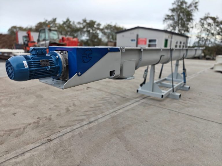Screw conveyor with drive motor and support stands